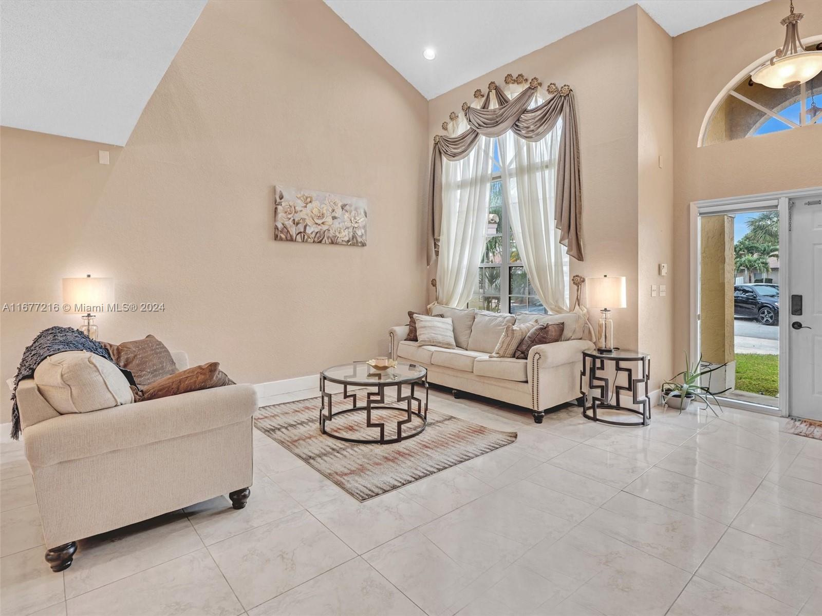 Discover luxurious living in West Pembroke Pines with this expansive 4-bedroom, 2-bathroom home offering over 2,200 sq. ft. of living space. Featuring dramatic vaulted ceilings and a spacious loft, this home is designed for comfort and style.
The master suite includes a walk-in closet and an ensuite bathroom with a jacuzzi-style tub, while the balcony offers serene views of the backyard. A converted garage serves as a fun man cave or can be used as a cozy den.
With ample space and contemporary features, this home is perfect for comfortable family living in the desirable West Pembroke Pines neighborhood.