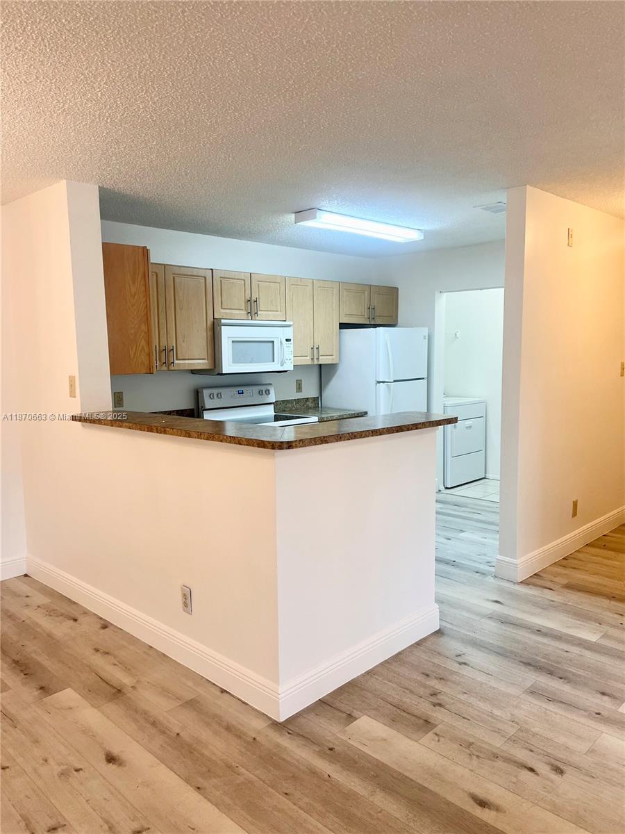 RENOVATED 1st Floor Unit !!! Shows like a model!! Modern flooring and newer baseboards in the whole unit!!! Painted walls with custom colors!!Brand New Beautiful bathrooms, Spacious Storage! All NEW closet doors. New AC and Water Heater! Brand NEW Washer and Dryer Inside. Community Pool and Ameneties!!Don't miss out wont last long! CLOSE TO SHOPPING, GOOD SCHOOLS AND RESTAURANTS, EASY ACCESS TO MAJOR HIGHWAYS.