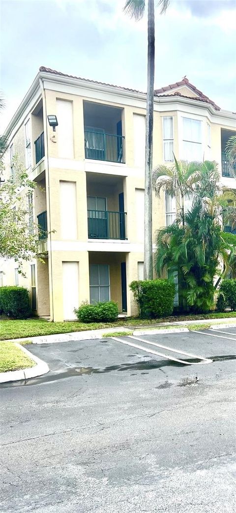Photo of 977 Riverside Dr #211, Coral Springs, FL 33071 (MLS # A11917846)