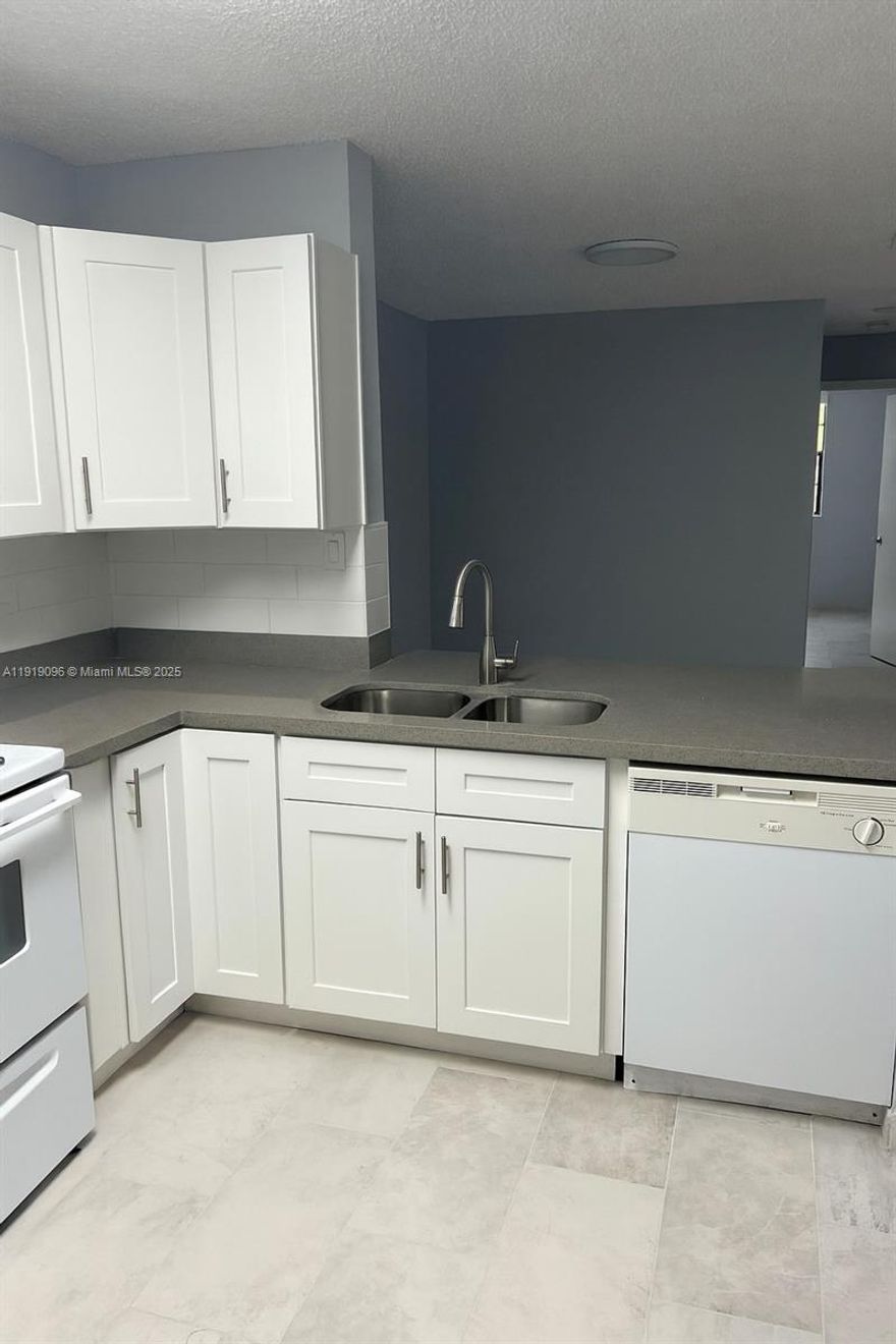 Ideal turnkey investment in investor-friendly community, OK to lease and corporate buyers welcome. Remodeled second floor three bedroom and two bath in Atlantic Springs. Prime location near the main pool and clubhouse. Minutes to Coral Square Mall, top restaurants, shopping, and excellent schools. Unit is currently rented to a long term tenant. Lease ends January 31, 2027! Property was remodeled in 2023 with new kitchen and floors. Newer water heater and brand new AC unit recently installed