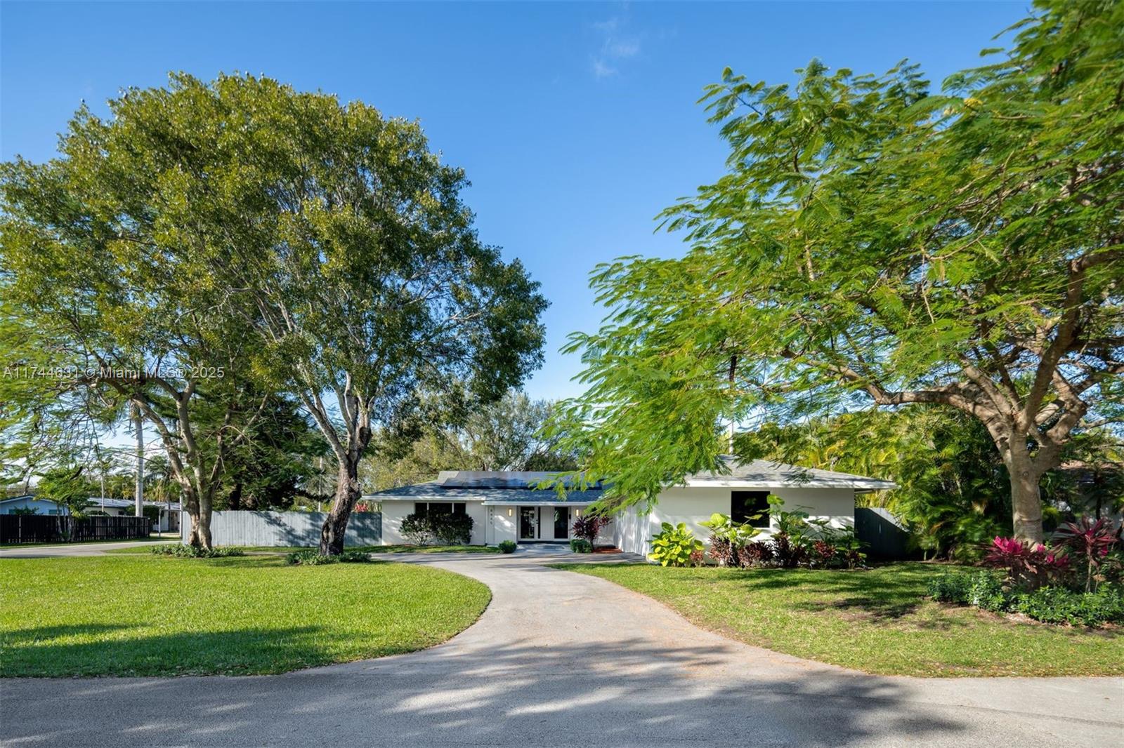 The one you’ve been waiting for! This meticulously renovated 4-bedroom + office studio, 3-bath home in a sought-after neighborhood sits on a spacious 14,895 SF corner lot. Every inch has been updated with high-end finishes, including Italian tile floors, impact windows, a new roof, electrical, and plumbing. The chef’s kitchen boasts top-tier appliances. The backyard is an oasis with a new fence, resurfaced pool deck, saltwater pool, heater, irrigation, lush landscaping, and fruit trees. Major upgrades include a new HVAC, owned solar panels, reverse osmosis water filtration, and an EV charger. The garage features new doors, insulation, mini-split HVAC, and refinished floors. An updated work studio adds versatility, providing extra space for work or living.