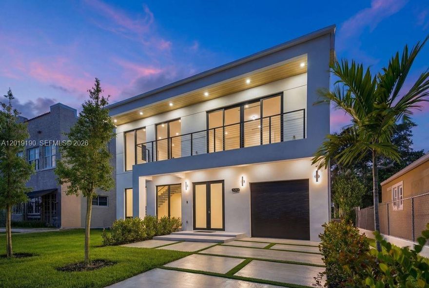 A bold expression of modern architecture in the heart of Little Havana, this newly constructed residence delivers a distinctly urban, loft-inspired lifestyle just minutes from Brickell, Downtown Miami, and LoanDepot Park. Dramatic 19-foot ceilings, a sculptural floating staircase, and gallery-like open interiors create an atmosphere that feels both sophisticated and effortlessly cool. The designer kitchen features striking surfaces, custom cabinetry, and elevated finishes curated for contemporary living. Upstairs, the primary suite offers a private retreat, while secondary bedrooms share a sleek Jack-and-Jill layout. Every bedroom opens to its own balcony and includes custom-built closets. Outside, a lounge-style patio was designed for entertaining under the Miami skyline. Rarely does a home with this level of architectural presence and modern edge become available in one of Miami’s most culturally iconic neighborhoods.