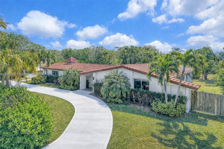 Best Value Near Pinecrest – Location, Land & Lifestyle! Don’t miss this exceptional opportunity to own a 4-bedroom, 3-bathroom pool home on over half an acre in one of Miami’s most desirable neighborhoods. Ideally located just three blocks from Pinecrest, this property offers unmatched value — delivering space, privacy, and potential.

Inside, open living areas are filled with natural light and offer a seamless flow for indoor/outdoor living and entertaining. The home is centered around views of the expansive backyard. The flexible layout includes an additional room that can serve as a 5th bedroom, home office, or playroom. Three bedrooms have ensuite bathrooms, and a designated laundry room with a utility sink adds convenience.

Step outside to your private outdoor oasis featuring a pool, pergola, and oversized green space—ideal for relaxing, entertaining, or future expansion. The generous lot offers a rare opportunity to customize, expand, or enjoy wide-open space in a prime location.

Additional features include a barrel tile roof, paved driveway, partial impact doors, and partial garage—ideal for a golf cart, storage, or hobby space. Walking distance to Coral Reef Park and top-rated schools, and minutes from dining, shopping, and fitness options, this home offers the perfect blend of convenience and tranquility. Recently reduced and priced to sell—an incredible value in a prime location.