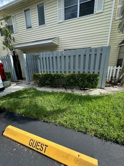Welcome to your Lakebridge Pompano beach style living community! Short drive to Pompano Beach, restaurants, and pier! Renovated Bright and airy townhome that features granite counter tops and stainless appliances, and sliders to a front fenced in patio. Renovated spacious. bathrooms. Gorgeous 18" tile downstairs and wood laminate upstairs. Upstairs full bath is Jack/Jill style with private sink area for each bedroom. Fans in the bedrooms. Closet organizers. French doors that lead out to Bricked Paved patio that is screened in. Black front loader washer/dryer located upstairs.. Great room has full sized sliders leading to oversized screened in porch, perfect for your morning cup of coffee or your evening glass of wine! Half bath downstairs. Plenty of parking. Cool off in the community pool!