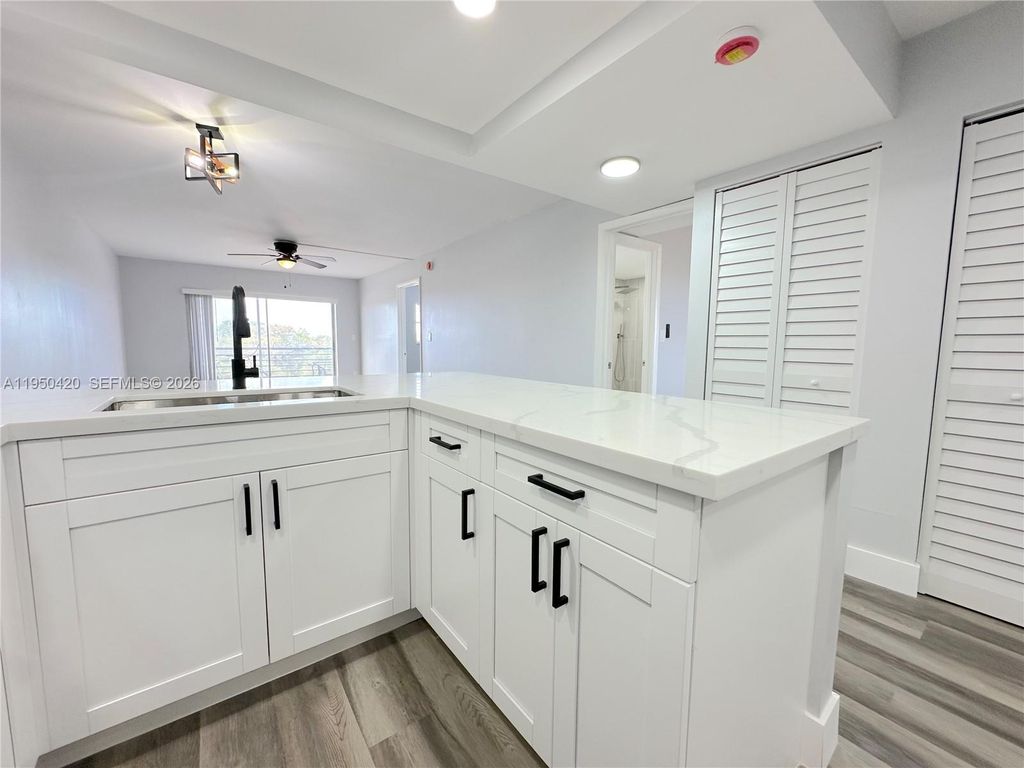 Photo of 3110 N Pine Island Rd #408, Sunrise, FL 33351 (MLS # A11950420)