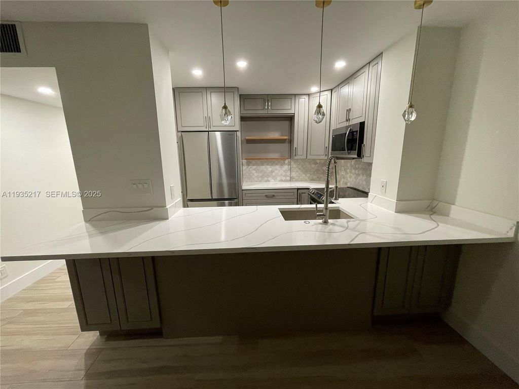 Photo of 1831 NE 38th St #403, Oakland Park, FL 33308 (MLS # A11935217)