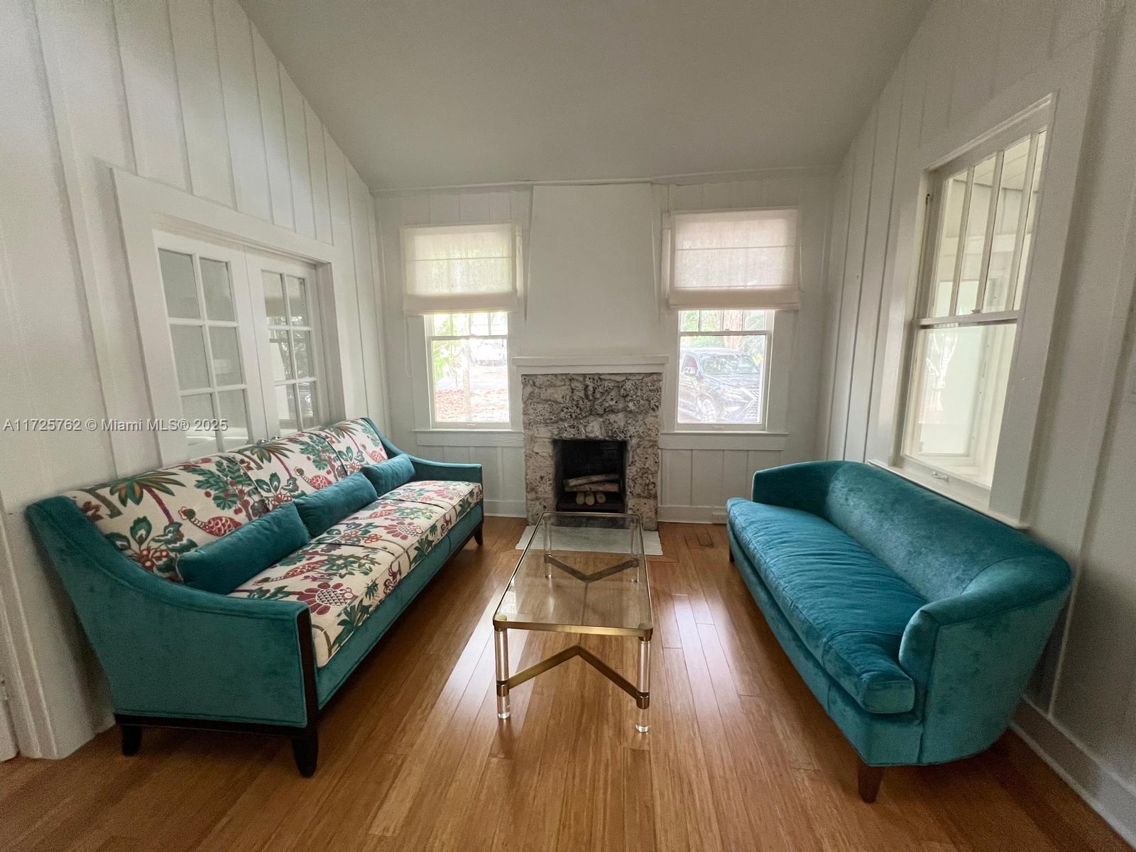 Located in the desirable Coconut Grove neighborhood, this 4-bedroom, 3-bathroom cottage, built in 1919, combines historic charm with the classic appeal of Coconut Grove. The home features high vaulted ceilings, a stone fireplace, and French doors as well as a serene backyard with a covered wooden deck and a pool. Located near the heart of Coconut Grove, residents have convenient access to premier dining, shopping, parks, marinas, and educational institutions.