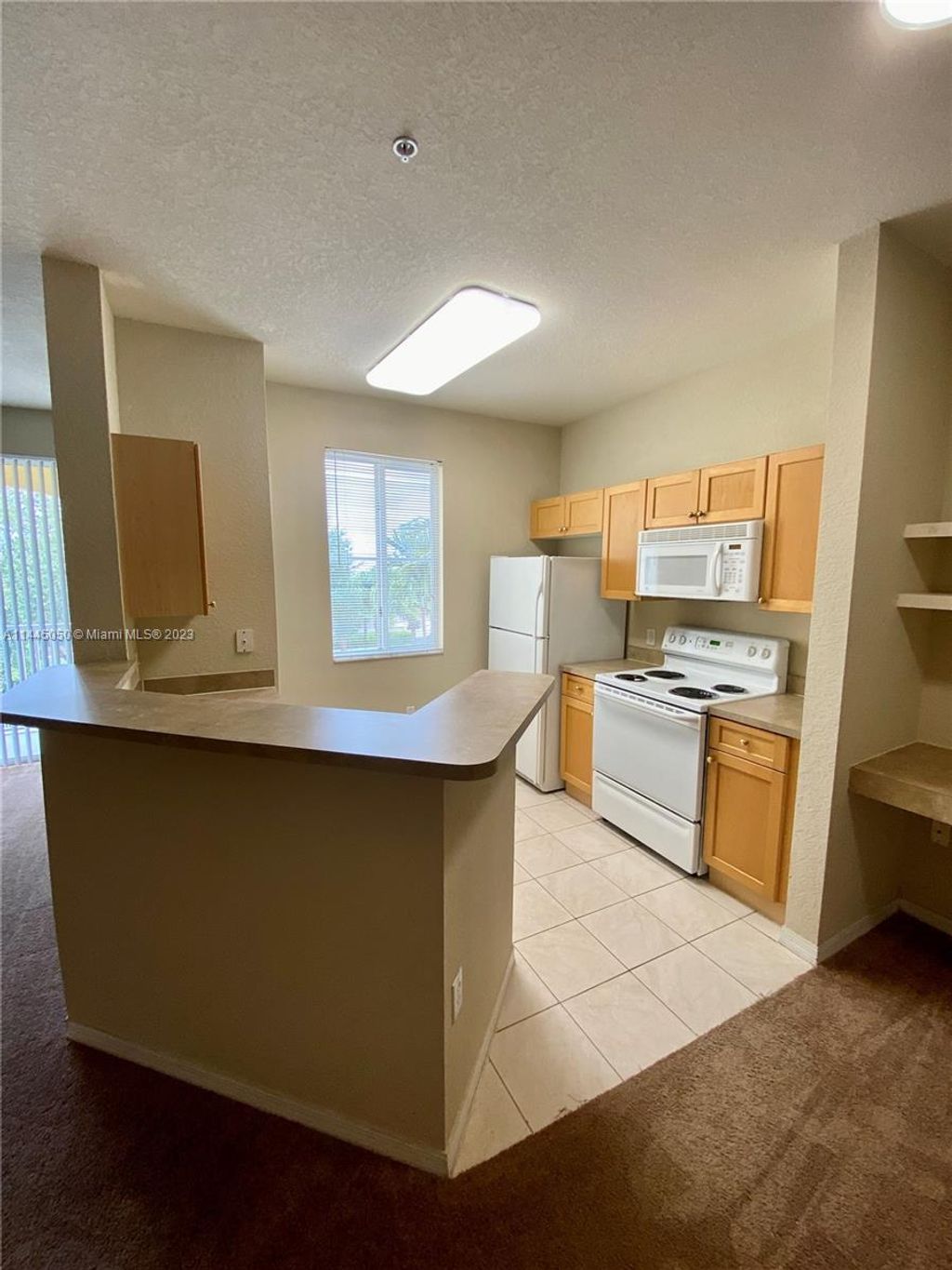 Photo of 11035 Legacy Blvd #302, Palm Beach Gardens, FL 33410 (MLS # A11445050)