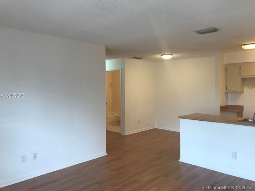 READY TO MOVE IN 2/BED 2/BATH AT BELLA GRAND. THIS IS A CORNER UNIT WITH SPLIT FLOOR PLAN. FRESHLY PAINTED. LAMINATED WOOD FLOORS THROUGHOUT. WASHER & DRYER IN UNIT. SCREENED PORCH W/STORAGE. WALK-IN CLOSET. ONE ASSIGNED PARKING SPACE. PEACEFUL AND QUIET COMMUNITY WITH POOL & TENNIS COURT. MINUTES TO SCHOOLS, SHOPPING, DINNING, ENTERTAINMENT AND MAJOR ROADS. WATER IS NOT INCLUDED. SORRY NO DOGS ALLOWED. UNIT WILL BE DELIVERED WITH NEW STAINLESS STEEL APPLIANCES.