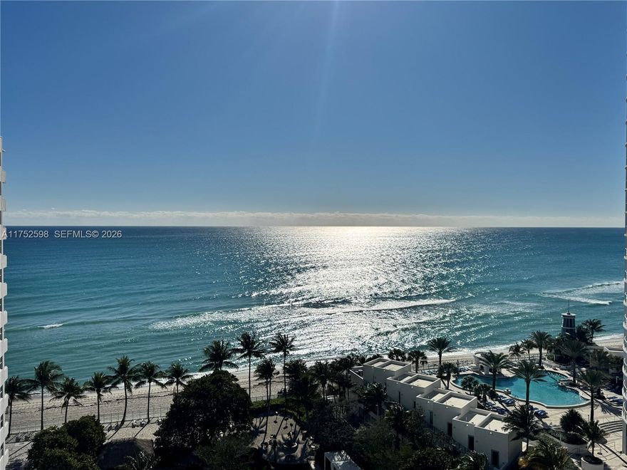 Stunning ocean views from this 2-bedroom, 1.5-bath, 1,251 SF unit in the fully renovated Residences on Hollywood Beach. Enjoy Italian cabinetry, granite countertops, impact windows, and new flooring throughout. The resort-style building offers two fitness centers, two heated pools, cabanas, tiki hut, 24-hour concierge/security/valet, and up to two parking spaces. Maintenance includes cable, internet, water, and pest control. Rentals allowed with a 6-month minimum. Furniture included. Warrantable building with 50-year certification. Easy to show!  FIRPTA Affidavit must be signed. Seller will pay off special assessment at closing