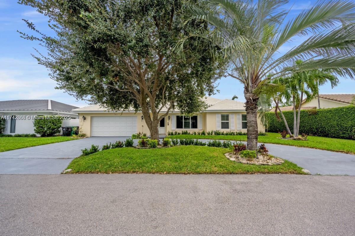 Welcome to your South Florida escape where design meets waterfront living.
This home offers 4 bedrooms plus den and 4 baths, providing flexibility for guests or office. Features include a game room with fireplace, two sunken living areas, and a long pool ideal for entertaining. Located in prestigious Lake Estates, near top amenities, cultural spots, and A-rated schools. Enjoy kayaking along canals where manatees glide or head to the beach. Boaters benefit from one fixed bridge to open water for smaller vessels and a nearby marina for larger yachts. Added perks: impact windows/doors and EV-ready 2-car garage.