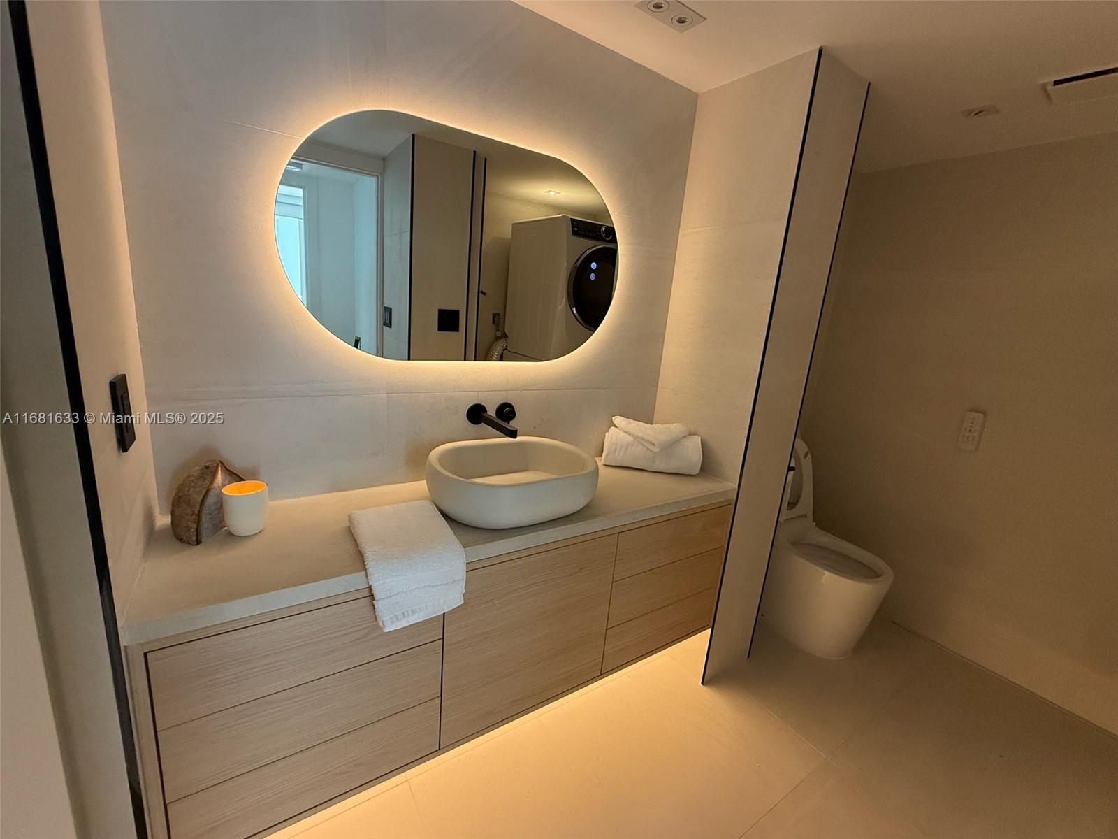 Discover unparalleled luxury in this designer-renovated corner unit, crafted with no expense spared. Featuring impact sliding doors, Italian porcelain, and abundant natural light. All new bathrooms offering dual shower systems, heated toilets w/ bidet, a heated towel rack, and a hot/cold plunge.
Enjoy ocean sunrises and city skyline sunsets from two balconies. The open layout with split bedrooms provides privacy and spaciousness, including automatic blinds, built in speaker systems, and all new specious closets.
The boutique-style building offers quick elevator access, above ground valet + premium self parking, beach club, tennis courts, a private marina offering exceptional pricing, and exclusive dining. Showings are easy. Also available for rent