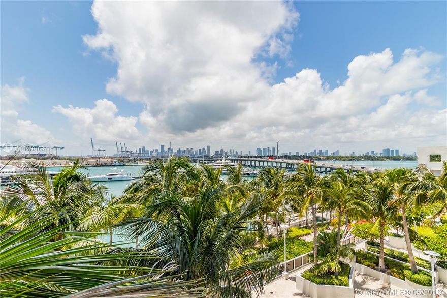 Large corner residence with perfect split floorplan including two oversized bedroom suites, open concept kitchen, dining area and a very large living room with spacious balcony surrounded by swaying palm trees.  The master bedroom offers a private second balcony with lovely views of the marina and Biscayne Bay, a separate office area, huge master bath with separate shower and spa tub plus a large walk-in closet. The amenities at Murano Grande will satisfy the most discerning resident and include a spa, gym, bay front swimming pool with full service restaurant service, a tennis court, and 24 hour concierge, front desk and valet. All of this plus the beach, South Pointe Park and everything 'south of fifth' has to offer just steps away.  Offered turn-key fully furnished for minimum 6 months