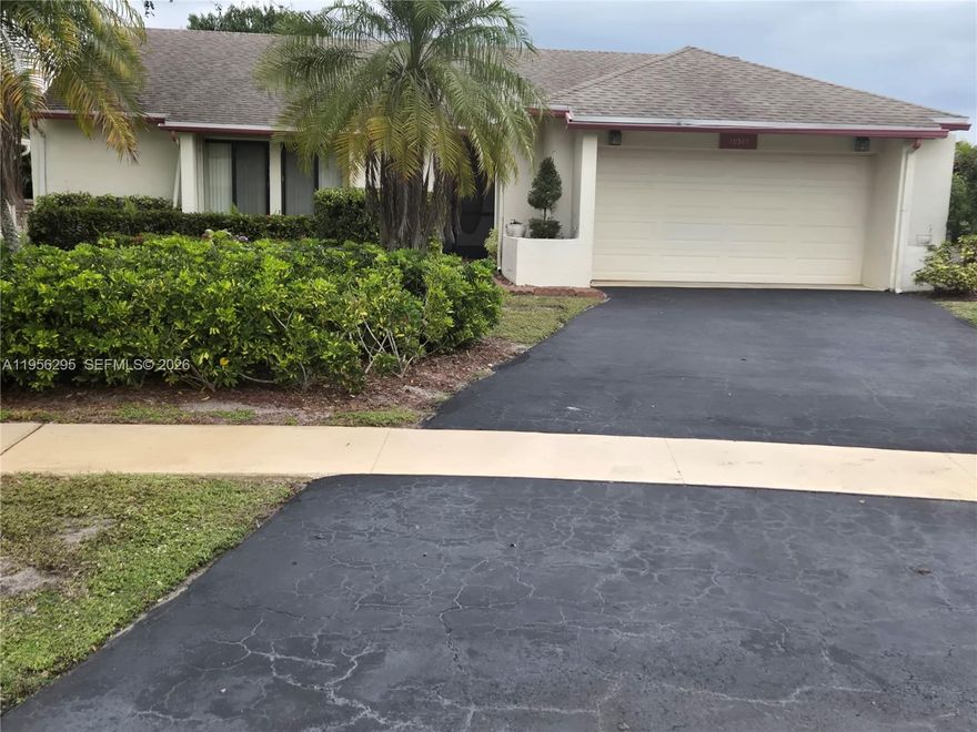 Spacious, bright, and well maintained 2 Bedroom detached home in Boca Chase 55+ subdivision, Greenbriar. Enjoy vaulted ceilings, natural light, and a 20x20 covered & screened patio. Banana and Mango trees in backyard, No Neighbors behind the home for privacy. The home features many updates including: 2017 roof, 2025 AC, newly installed hurricane impact windows. New washer. Meticulously kept up property.