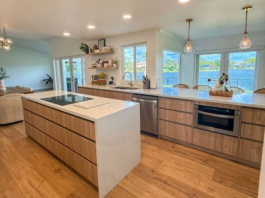 Modern luxury living in Chapel Trail – Pasadena II. Stunning fully remodeled estate home featuring 4 bedrooms plus a converted garage that can be used as a 5th bedroom, gym, or flex space, 3 full bathrooms and 1 half bath, with nearly 3,000 sq. ft. of beautifully designed living space. This home is exceptionally bright and filled with natural light, offering a warm and inviting atmosphere throughout. The open-concept layout is ideal for both everyday living and entertaining. The property showcases high-end finishes, including a modern Italian-style kitchen with elegant cabinetry, granite countertops, recessed lighting, and top-of-the-line appliances. The primary suite is conveniently located on the first floor and features a spacious master bathroom, a walk-in closet plus two additional closets, and a cabana-style bathroom with direct access to the patio, providing added convenience for guests and outdoor use. Upstairs you will find three generously sized bedrooms and one full bathroom. The home also includes impact windows throughout and a laundry room on the first floor. Enjoy a spacious and cozy backyard, fully fenced for privacy, with a beautiful and serene lake view, perfect for relaxing or entertaining. Located in a highly desirable and family-friendly community, close to top-rated schools, parks, shopping, dining, and major highways. Internet & tv cable included with the rent