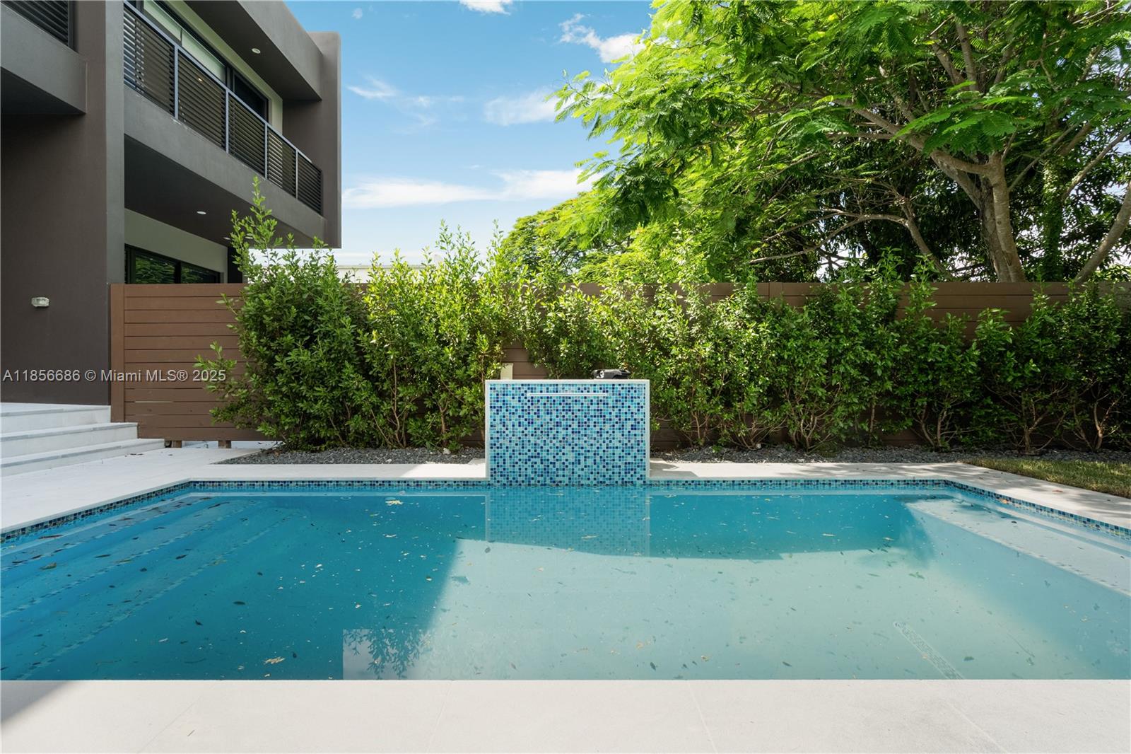 Stunning New Construction 4BD/4BA Modern Townhome Experience luxury living just steps from Coconut Grove and Coral Gables, and minutes to Brickell and Downtown Miami. This brand-new modern townhome features four spacious bedrooms and four full bathrooms, with high ceilings on both levels and sleek porcelain tile flooring throughout. The European-style kitchen boasts premium cabinetry and appliances, complemented by elegant imported marble bathrooms and built-in closets in every bedroom. Enjoy outdoor living with a private pool, covered patio, and a generously sized fenced yard. Additional features include full size washer and dryer on the second floor, Kohler and Duravit fixtures, a one-car garage, and gated parking. Pool and yard maintenance included in rent.