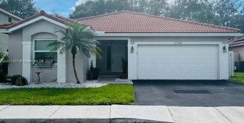 Photo of 12740 NW 11th Ct, Sunrise, FL 33323 (MLS # A11891401)