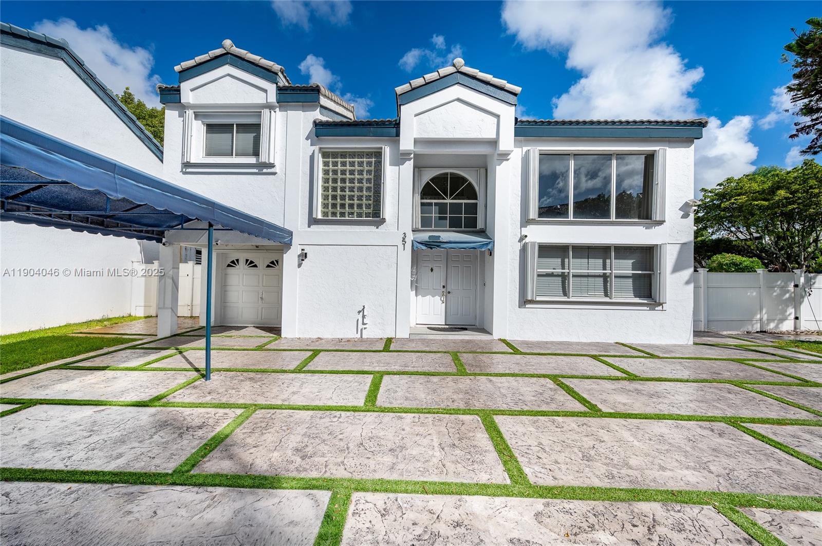 Beautiful, well-maintained single-family home in the guard-gated community of San Simeon. Situated on one of the largest corner lots in the subdivision, this home features a contemporary kitchen with real wood cabinets, stainless steel appliances, and granite countertops. Covered carport fits up to 6 cars. Large screened-in patio and spacious pavered backyard, perfect for entertaining. Special vinyl plank floors downstairs. The master bedroom includes an updated bath with a high-end shower and a private upstairs balcony. Newer roof and AC (2023) Hurricane-rated accordion shutters throughout. The community offers pool, tennis, basketball, gym, and more. HOA includes,  landscaping, ext. painting, cable, and roof painting. Conveniently located near Aventura Mall, restaurants, and I-95.