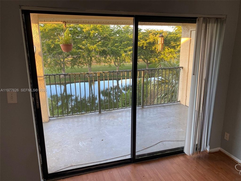 Photo of 9999 Summerbreeze Dr #618, Sunrise, FL 33322 (MLS # A11977626)