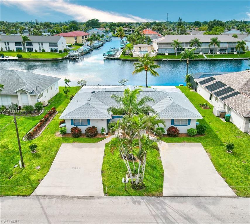 Price adjustment! This beautifully maintained duplex offers Western exposure overlooking the Rubican Canal, a 200-foot-wide Cape Coral waterway that flows directly to the Caloosahatchee River and the Gulf of Mexico. Each side of the duplex features: a spacious great room, two bedrooms and two bathrooms, Eat-in kitchen, Florida room under air conditioning, and Lanai for outdoors relaxation. Additional features include Tile flooring throughout, Walk-in closets, large primary bathrooms, Concrete dock with easy access to the water. Separate electric and water meters for each side, and Assessments paid in full. New roof in 2023. Enjoy stunning sunsets across the water on the intersecting canals.