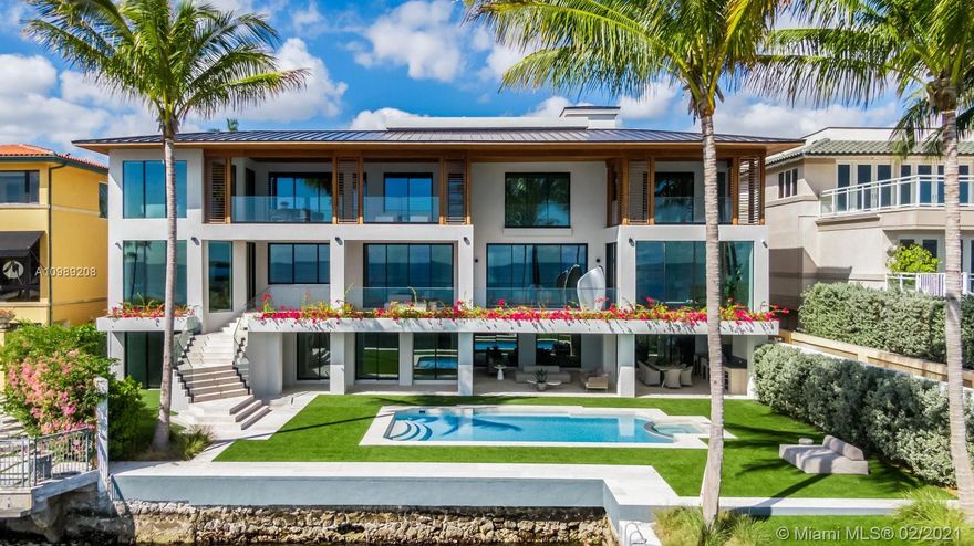 Magnificent 15,638 Sq. Ft. Bayfront residence re-designed in 2020 by architect Cesar Molina, with incredible views of Biscayne Bay and 110 ft of water frontage. Modern and seamless layouts on all three floors and covered balconies create a luxurious living experience ideal for sophisticated entertaining. The resort-style home, with 7 bedrooms and 6 full and 2 half baths, including a main suite with a spa-style bath, is surrounded by manicured lawns and mature palms. The interiors open to a spacious terrace with an outdoor kitchen and sweeping views of the pool, private dock and Biscayne Bay. Featuring an elevator, theater, refrigerated wine room, gourmet kitchen, and generously proportioned rooms, the home resonates sophistication and comfort.  A truly incomparable and majestic residence.