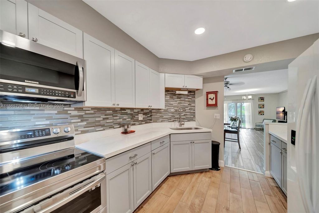 Photo of 3575 Broken Woods Dr #201, Coral Springs, FL 33065 (MLS # A11865726)