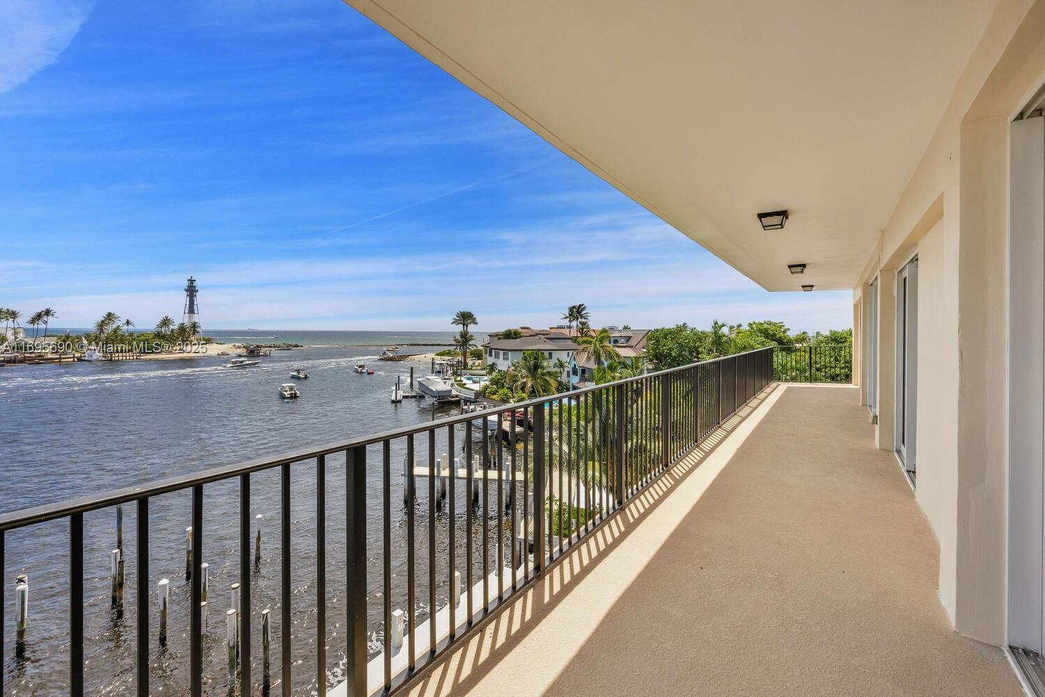 Rare full-floor penthouse in an intimate 9-unit waterfront building in Hillsboro Shores. Featuring a private 200+ sq ft rooftop sundeck/terrace plus a 50ft balcony with sweeping views of the Lighthouse, inlet & ocean. Elevator opens directly into a 4BR/3BA residence with a flexible layout. Ready for personalization—refresh & design your dream penthouse retreat in one of Pompano’s fastest-growing areas. Assigned dock slip, no fixed bridges. New pool & deck upgrades underway, 40-yr certification complete, no pending special assessments. Nestled in a single-family enclave with unmatched views & gated beach access just steps away. A seasonal escape or year-round living!