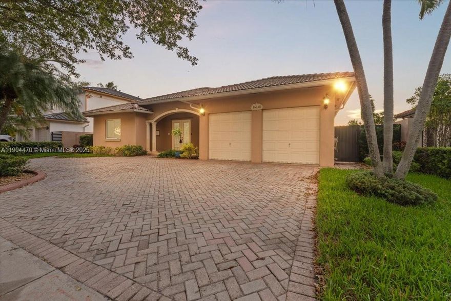 Welcome to this elegant 4-bed, 3.5-bath home with in-law quarters in the prestigious Royal Oaks community of Miami Lakes. Step inside to bright, open living areas and a beautifully remodeled kitchen featuring modern cabinetry, quartz counters, and plenty of space to cook and gather. The split layout offers privacy and comfort, ideal for extended family or guests. Enjoy outdoor living with a covered patio and fenced yard perfect for BBQs or relaxing evenings. Located on a quiet, tree-lined street near top schools, parks, shopping, and highways—this home is move-in ready and waiting for you!
