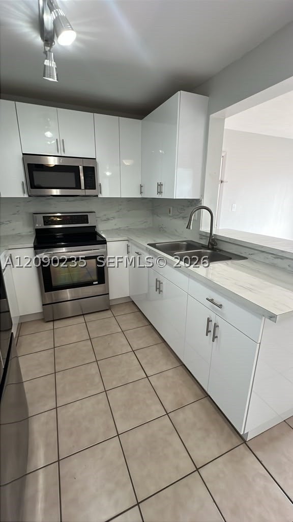 Photo of 200 W Palm Cir W #104, Pembroke Pines, FL 33025 (MLS # A12090235)