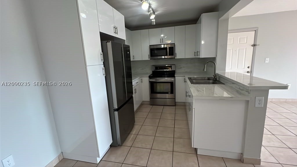 Photo of 200 W Palm Cir W #104, Pembroke Pines, FL 33025 (MLS # A12090235)