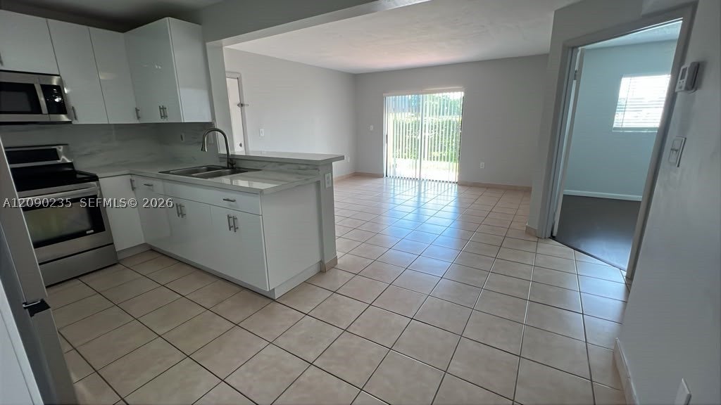 Photo of 200 W Palm Cir W #104, Pembroke Pines, FL 33025 (MLS # A12090235)