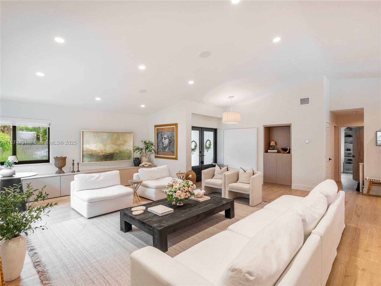 This exquisitely designed and remodeled 3 bed, 2 bath residence offers a seamless blend of sophistication and modern convenience. The open-concept design with soaring ceilings creates an airy, elegant living space, complemented by a spacious chef’s kitchen featuring all new appliances, including a gas stovetop. Garage is equipped with A/C and built in cabinetry for flexible living/recreational use. Your outdoor oasis features a heated, saltwater pool and covered pergola with ambient lighting built for entertaining. With Lutron Ketra lighting, whole-home audio, and a Savant system that responds to a tap or voice command, this Smart Home seamlessly adapts to set the perfect mood indoors and out. Key features: 2021 roof, all impact windows/doors, backyard completely turfed and landscaped.