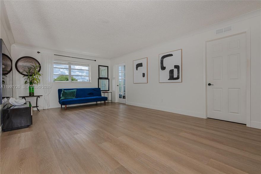 Beautiful and totally remodel unit!  Extra large one bedroom in the Arrowhead community.  This unit is move in ready with no projects because the seller did it all.  Unit has been totally remodeled within the last year: new kitchen with new quartz countertop and lots of storage cabinets, new recess lighting, new crown molding, new baseboards, new luxury waterproof flooring, new stainless steel appliances and recess lighting, nicely remodeled 1/2 bath, large bedroom, extra large closets.   This unit has lots of natural light, large patio with a scenic and serene view of the golf course, additional storage in the building and assigned parking.  This great community is conveniently located within walking distance to Nova University and other colleges, shopping centers and great restaurants.  The community has completed their 40 year inspection so no upcoming assessments.  Show today, no disappointment with this unit!