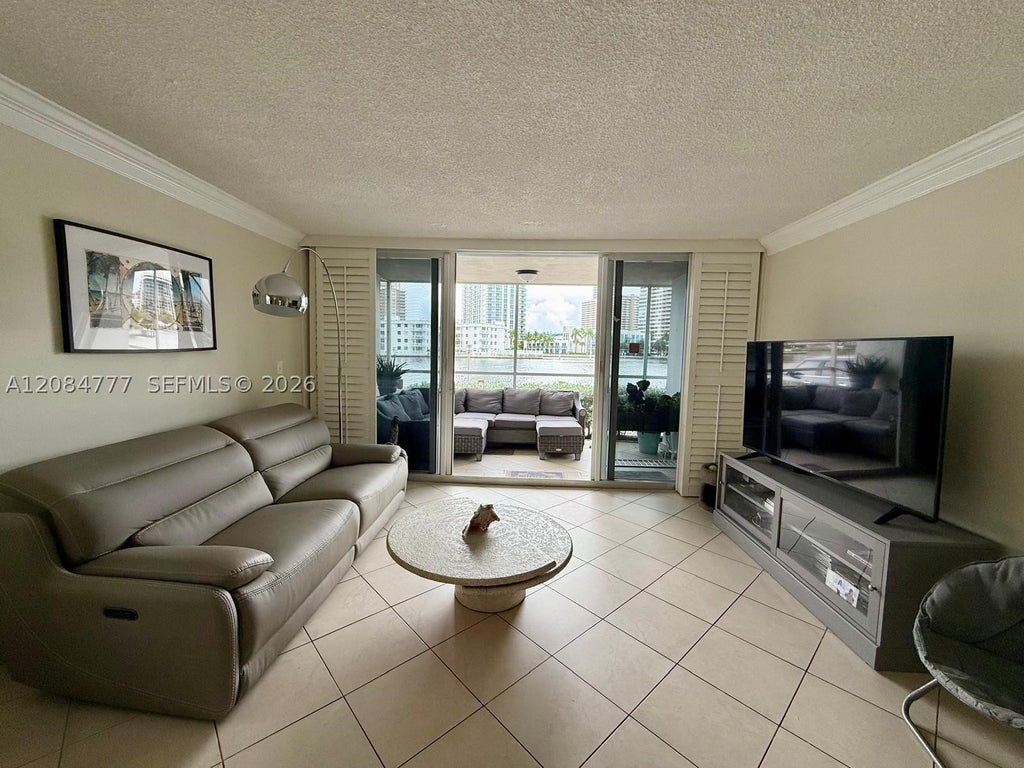 Photo of 121 Golden Isles Dr #1, Hallandale Beach, FL 33009 (MLS # A12084777)