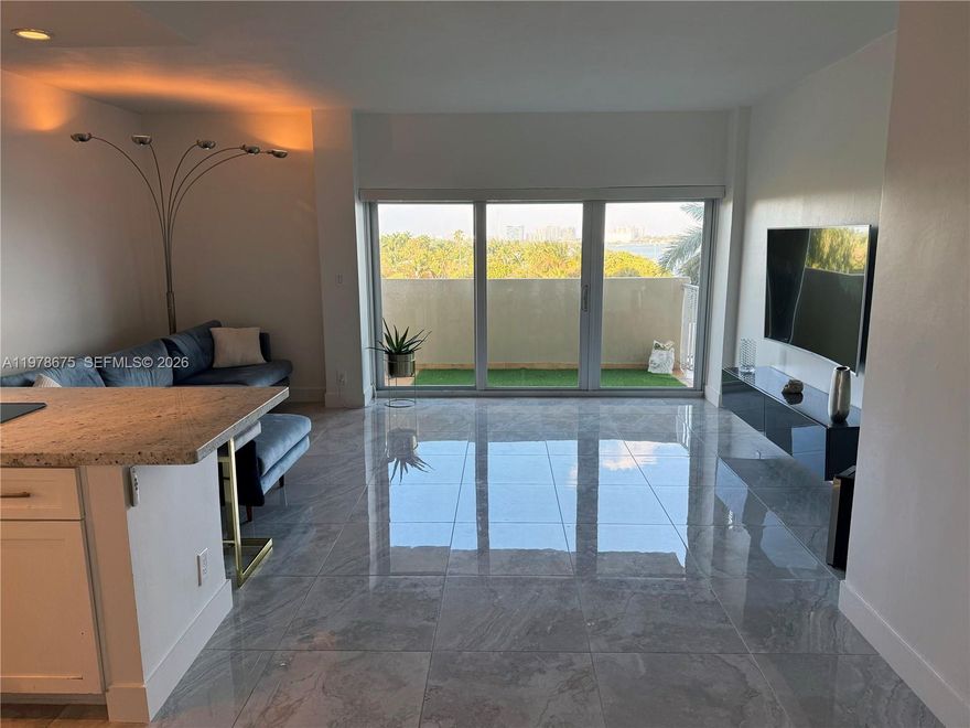 VIEWS VIEWS VIEWS!! Turnkey waterfront condo in the thriving MiMo District! To all foreign and out-of-state investors: this is the fastest growing area in Miami. This beautifully upgraded 1/1 will have you enjoy calming unobstructed water views from the living room, bedroom and balcony. It truly defines what Miami living is all about! Bright, spacious, and filled with welcoming energy, this unit features an open-concept kitchen and entrance, new modern flooring, motorized blinds in the living area, blackout shades in the bedroom, two California-style closets, and hurricane-impact windows. New refrigerator and dishwasher appliances recently installed. Enjoy a peaceful, residential feel while being steps away from a local waterfront park enclosed in a quiet community, Biscayne Blvd and the best of the Upper East Side. Nice neighborhood with fantastic restaurants and weekly farmer's market nearby! Resort-style amenities include a large waterfront Pool, 2 Saunas, Tennis court, Rec room, 24/7 Security and 1 designated parking spot. The A/C is included in the monthly maintenance fee (low electricity bill around $40). Recently remodeled lobby, saunas, and updated pool deck. The entire property is gated and secured 24/7. Priced below its last appraisal, do not miss this opportunity. Ready for move-in or investment rental. Well managed building, no Special Assessments. Easy to show - text listing agent.