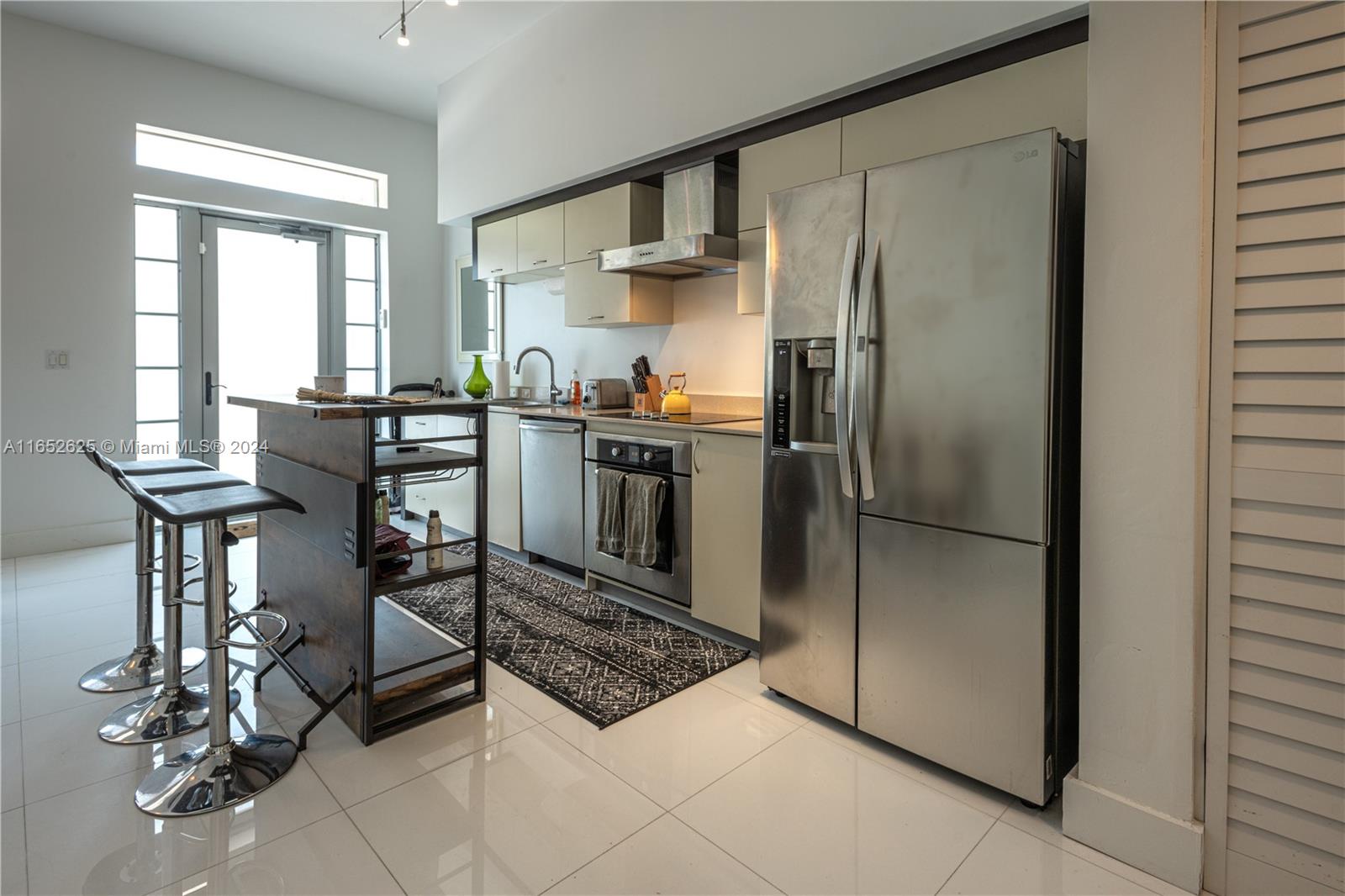 Very bright and spacious 2 stories townhouse style condo in South Beach with private entry. This unit has 12 foot Loft style ceilings and white Marble floors. Birch Hardwood floors on stairs and bedrooms. Kitchen is open with top of the line appliances. Artecity is located 2 blocks from the beach. Close to the W and Setai Hotels, steps from new Convention Center and Bass museum. The complex has full amenities, including beach service with chairs and umbrellas, 2 pools, gym and more.