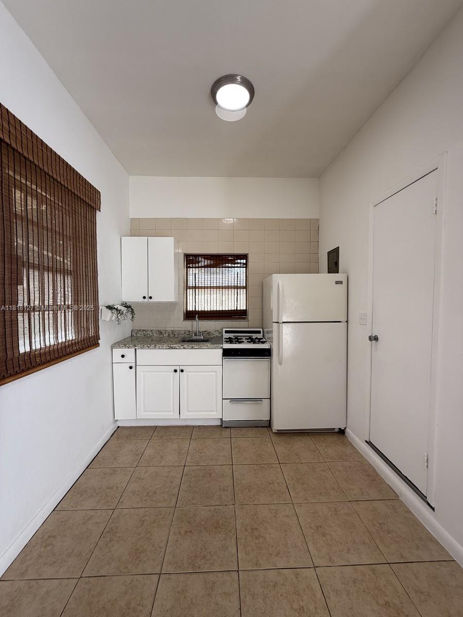 QUICK Move-in! UTILITIES INCLUDED! Miami Shores Area, well-maintained efficiency is perfect for a college student or working professional seeking a quiet, convenient living space near University's. Key Features: • Studio layout with tiled flooring throughout • Kitchenette includes gas stove, full-size refrigerator, granite-look counters, and upper/lower cabinets • Private bathroom with stand-up shower • Space fits a single or full-size bed, a small dining set, and a laptop desk setup near the front entrance • Private entrance with natural light and window blinds • Off-street parking available Rent includes all utilities: Gas, water, electricity, and Wi-Fi Location Highlights: • Located just 12 minutes to FIU, 1.5 miles from Barry University (about a 5-minute drive) No smoking, no pets