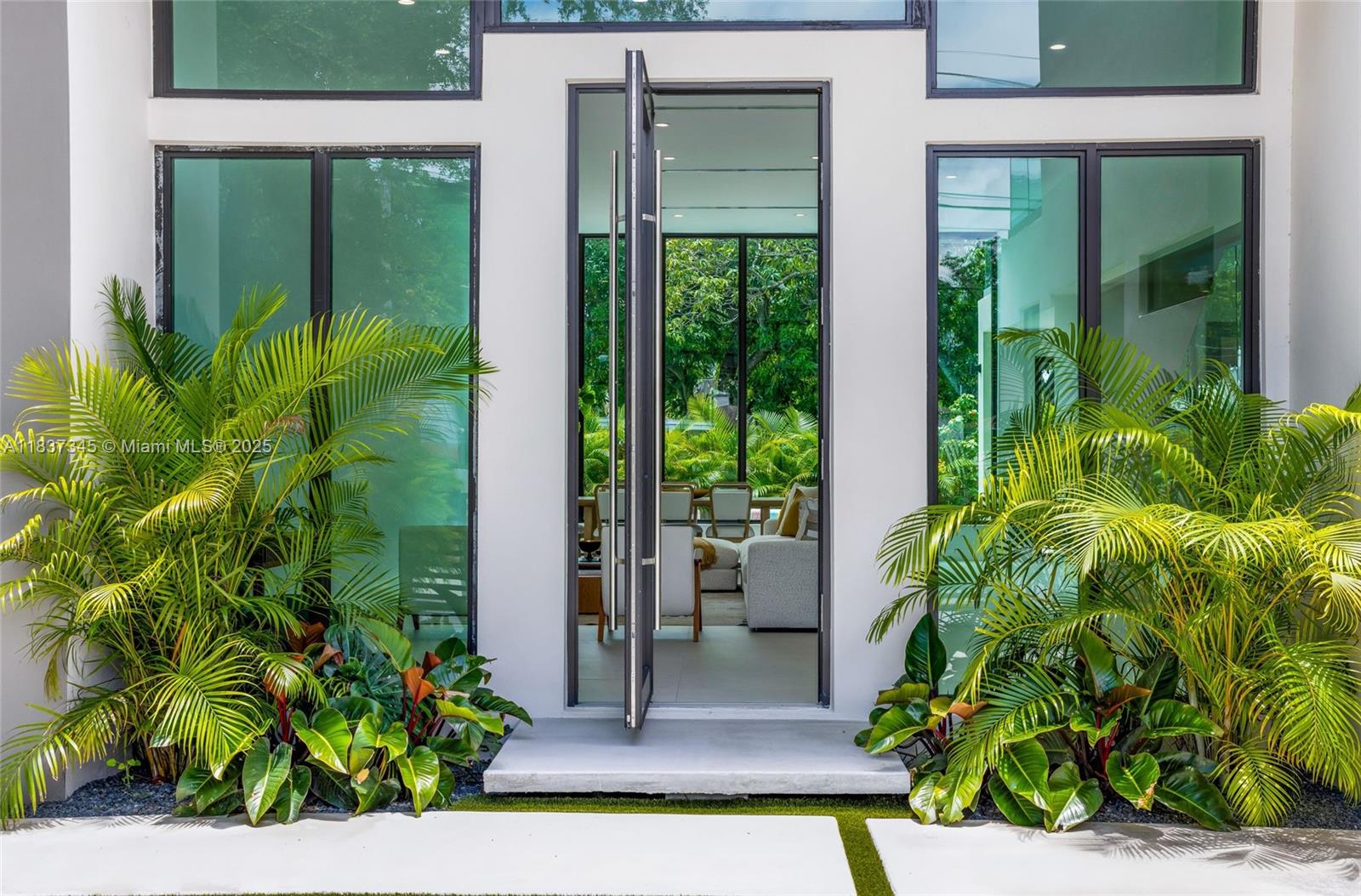 Located just blocks from the Design District and minutes from Wynwood and the beach, this STUNNING new construction offers 4 bedrooms, a den, 3 full bathrooms, and a powder room. The home features 13-ft ceilings, a grand pivot door, and large windows for bright, open living spaces with seamless indoor-outdoor flow. Enjoy a private saltwater pool, summer kitchen with built-in BBQ, and a covered terrace—perfect for entertaining. High-end finishes include impact windows/doors, Italian appliances, custom cabinetry, and closets. Gated with a 1-car garage for added privacy and security. A perfect blend of luxury and functionality in one of Miami’s most vibrant neighborhoods.