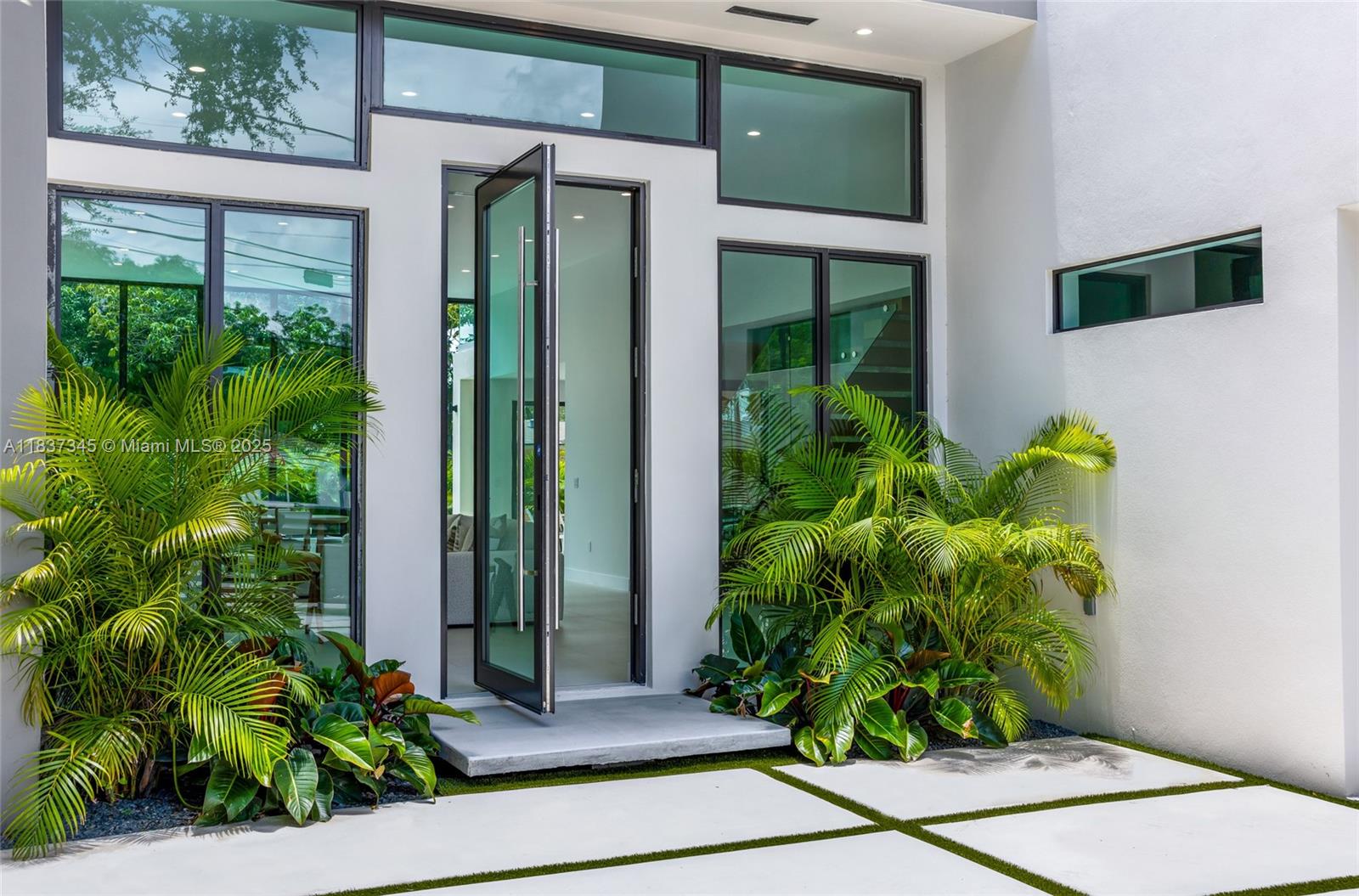 Located just blocks from the Design District and minutes from Wynwood and the beach, this STUNNING new construction offers 4 bedrooms, a den, 3 full bathrooms, and a powder room. The home features 13-ft ceilings, a grand pivot door, and large windows for bright, open living spaces with seamless indoor-outdoor flow. Enjoy a private saltwater pool, summer kitchen with built-in BBQ, and a covered terrace—perfect for entertaining. High-end finishes include impact windows/doors, Italian appliances, custom cabinetry, and closets. Gated with a 1-car garage for added privacy and security. A perfect blend of luxury and functionality in one of Miami’s most vibrant neighborhoods.