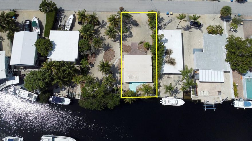 Fantastic and RARE Opportunity to build NOW!!! Owner financing possible! 50' OF WATERFRONT 6250 SQ FT Plantation Key Islamorada LOT WITH A BUILDING RIGHT included! Also purchase the lot next door for HUGE DOUBLE LOT !! T-Dock possibility on the mangrove lot, PLUS this lot with a house has a small dock with various dock and lift options possible, DEEP WATER at shoreline. Use the house as your getaway while you build on the other lot, or build two 2 homes, or an estate? Fabulous and popular neighborhood with easy Ocean and Bay access A voluntary HOA provides access to the private bay front homeowner's park, beach, truck/trailer parking, and boat ramp! Build your dream home Right Here Right Now! Ask about buying vacant lot next door too! Try your offer, priced to sell!