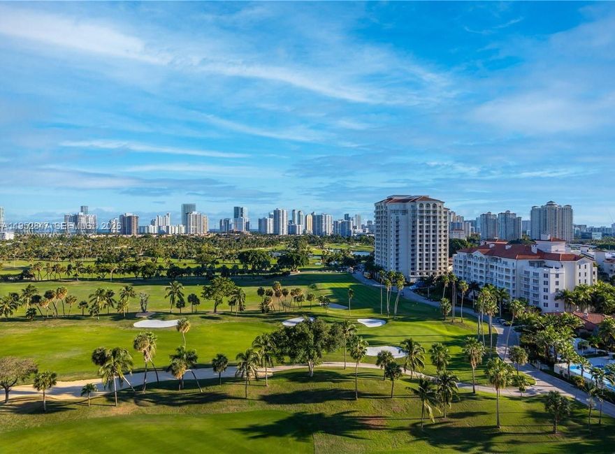 Perched on the 25th floor of a 27-story tower, this spacious 2-bedroom, 2-bath condo offers sweeping views of lush golf courses and stretches all the way to the Atlantic Ocean. Located in the heart of Aventura, this residence is ideal for those who crave a vibrant lifestyle balanced with tranquil, scenic beauty. Enjoy being behind Aventura Mall, upscale dining, scenic parks, schools, golf clubs, and a diverse selection of places of worship—making this one of the most desirable communities in South Florida. The unit presents a rare opportunity to remodel the space with a custom renovation, turning it into a showplace that fully matches the grandeur of its views. Floor-to-ceiling windows invite stunning natural light throughout, showcasing breathtaking sunrises and sunsets. You can jog or walk along the picturesque golf course path that loops around the area—perfect for outdoor fitness with views. Enjoy close-by padel and tennis courts for an active lifestyle. This property delivers location, potential, and undeniable value. The well-maintained building features resort-style amenities including 24-hour security, concierge, a fitness center, pool, and more. This is the perfect opportunity to create your ideal South Florida home with an amazing view!