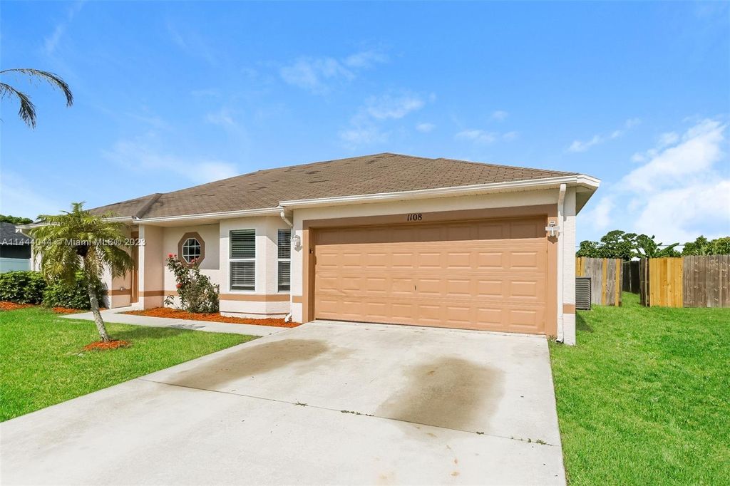Photo of 1108 SW Hogan St, Port Saint Lucie, FL 34983 (MLS # A11444044)