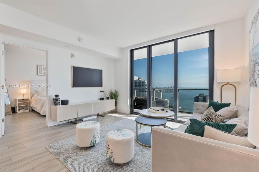 SPECTACULAR WATER AND CITY VIEWS from this turnkey luxury unit in the coveted "03" line, at 1010 Brickell Condo. Enter through your PRIVATE ELEVATOR into this 43rd floor move-in ready spacious condo, with designer and high-end neutral furnishings, and upgraded wood porcelain floors. Split floorplan layout with 2 Bedrooms and 3 Bathrooms + Den. Den has desk for office space, and a couch that doubles as a full-sized bed. Features include top-of-the-line appliances, including washer/dryer, 3 TVs, fully-equipped kitchen, blackout shades, and more. Bring only your toothbrush! 1010 Brickell is centrally located and has every amenity imaginable, including indoor and outdoor pool, spa (cold dip/hot tub/sauna), arcade, running track, squash court and basketball court. SHORT TERM OK - Please inquire for short term pricing. Available June 1 through November 1. Tenant occupied - need 24 hour notice. Showings start April 9.