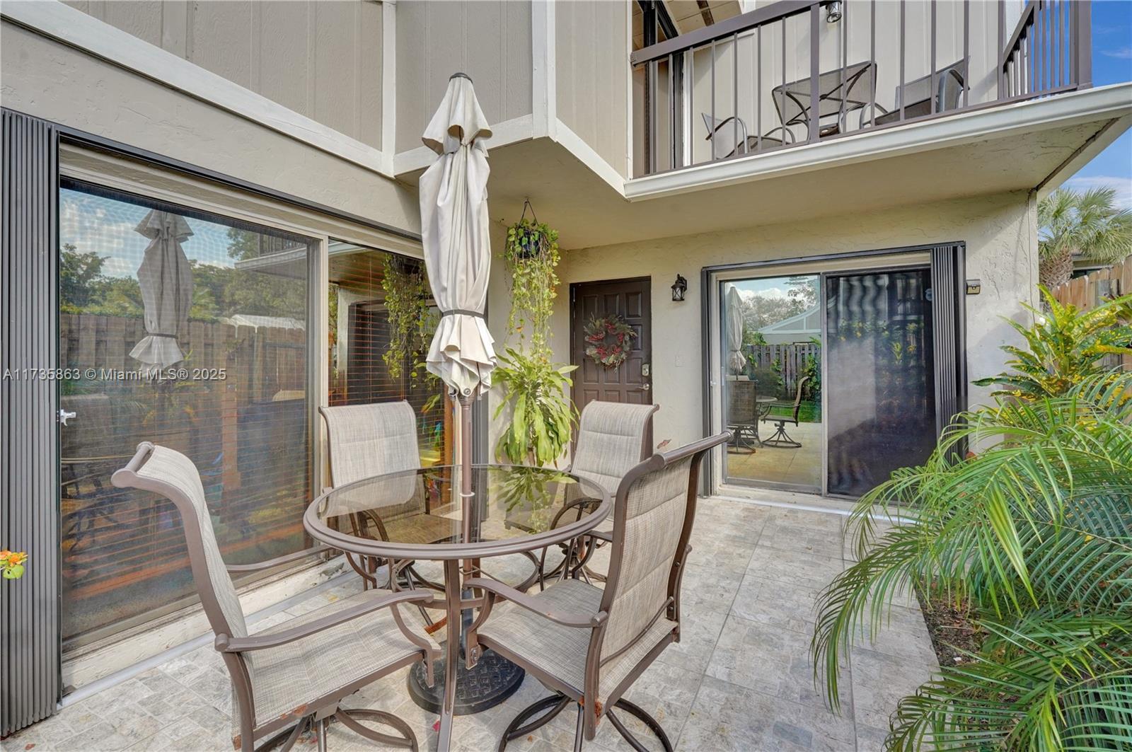 This beautiful townhome is located in western Plantation, centrally located between I-595 and the Sawgrass Expressway, close to shopping, restaurants and so much more. This home is a corner unit with its own private, fenced-in yard, complete with a perfectly sized patio and fruit trees. Inside, you will find a beautiful kitchen that opens up to the dining area, updated stairs with a modern railing, recently installed flooring on the second floor, and a remodeled full bath. The unit contains impact windows and a separate laundry space. Also convenient to this home are two parking spaces just feet from the front entrance. This home is a must-see!