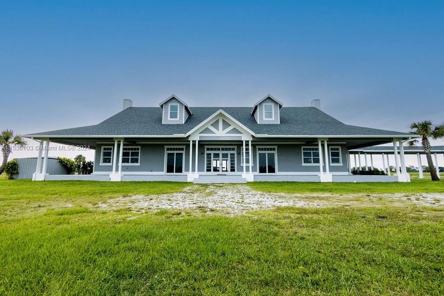 Own one of the largest farms in Martin County Ranches. The "Big G" is a remarkable 7,425 SF (3,400 SF under air) estate home on 21.3 acres offering the ultimate in privacy. Gated entrance within the gated community, brings you to a show stopping home at the end of the driveway. This ranch home boasts 3 BR, 3 1.2 baths with vaulted beamed ceilings, separate office, open living area, fireplace, kitchen and separate dining area. Traditional Florida wrap-around porch, outdoor kitchen and gas fire pit. Swimming pool overlooking wood deck on the edge of the lake. A true nature lover's haven can be your new family home.
