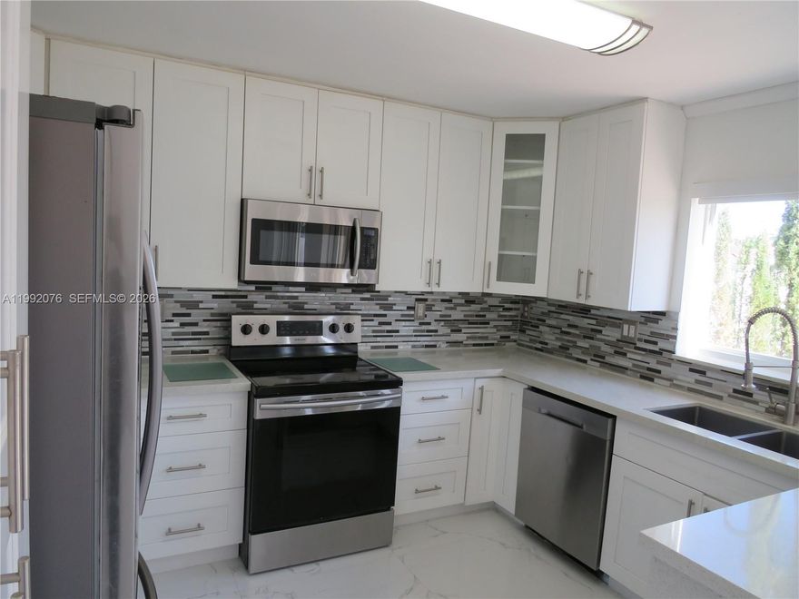 This beautiful home features 4 bedrooms, 2 bathrooms, and a half. Enjoy a modern kitchen, tile floors on the first level, and laminated floors upstairs. Impact windows provide maximum security, and the home is well-maintained, with fresh paint and a lake view. Don't miss the chance to live in this perfect home!