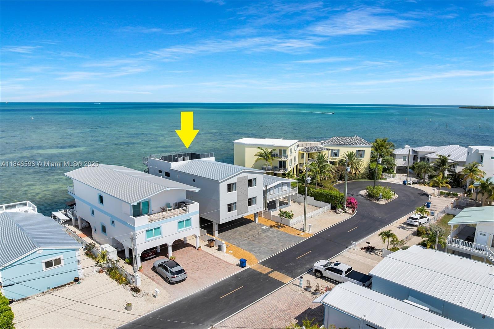 Spectacular Tavernier Oceanfront Concrete Home with Stunning Atlantic Views & Prime Boating Access Discover your dream waterfront retreat in the heart of the Florida Keys! This impressive 6-bedroom, 5-bathroom three-story concrete masterpiece in Tavernier offers breathtaking panoramic views of the turquoise Atlantic Ocean from nearly every room. The home features elegant marble and porcelain floors, high-end finishes, and abundant natural light throughout. Access all levels with ease via the interior staircase or private elevator. The open-concept main living area on the second floor boasts floor-to-ceiling windows showcasing endless ocean views, a gourmet chef's kitchen with Café appliances, quartz countertops, and a striking onyx island—perfect for hosting friends and family.
