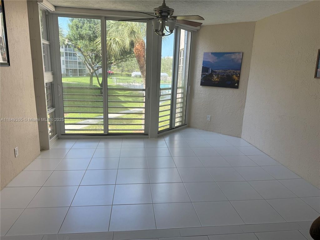 Photo of 1920 Sabal Palm Dr #201, Davie, FL 33324 (MLS # A11849265)
