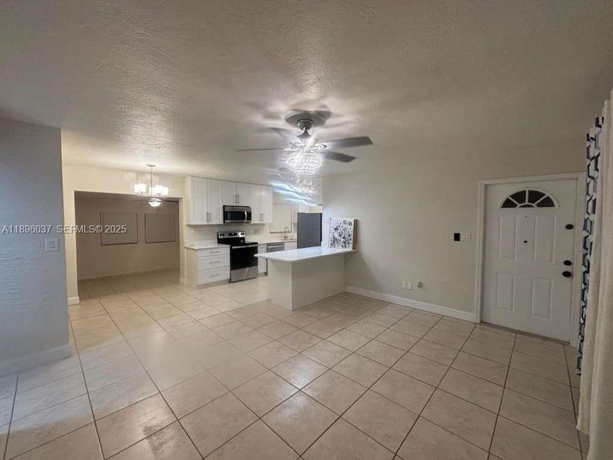 Welcome to this MOVE-IN READY, 2-bedroom, 1-bath single-family home! Recently renovated kitchen & bathroom  feature modern finishes and plenty of cabinetry. Tile floors throughout make upkeep easy, and natural light fills every room. Each space includes a ceiling fan and modern light fixtures, combining comfort with style. Large laundry room with washer/dryer hookups and a versatile additional room — ideal for a home office, guest room, or den. Fresh paint throughout gives a clean, welcoming feel. Step outside to a generously sized backyard with room for a pool, gazebo, grill, or swing set—great for entertaining or relaxing, the choice is yours. With a perfect blend of comfort, function, and future potential—don’t miss your chance to make this home yours!