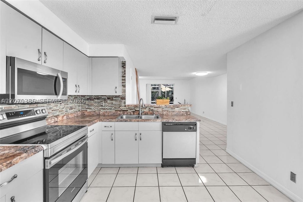 Photo of 800 Sorrento Dr #2, Weston, FL 33326 (MLS # A12070386)